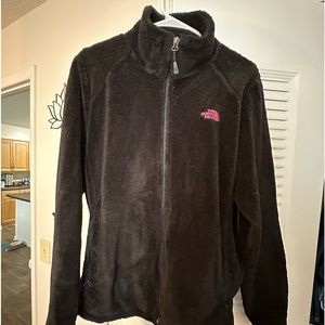 Black northface coat with the breast cancer awareness ribbon. Size XL.
